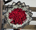25 Red Roses with Baby Breath Back Transparent Wrapping